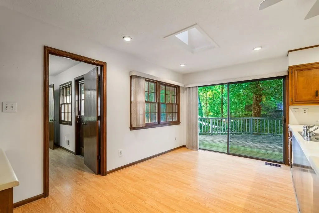 This Hallway Leads To The Garage For Easy Grocery Access, Washer & Dryer Room & Guest Powder Room!