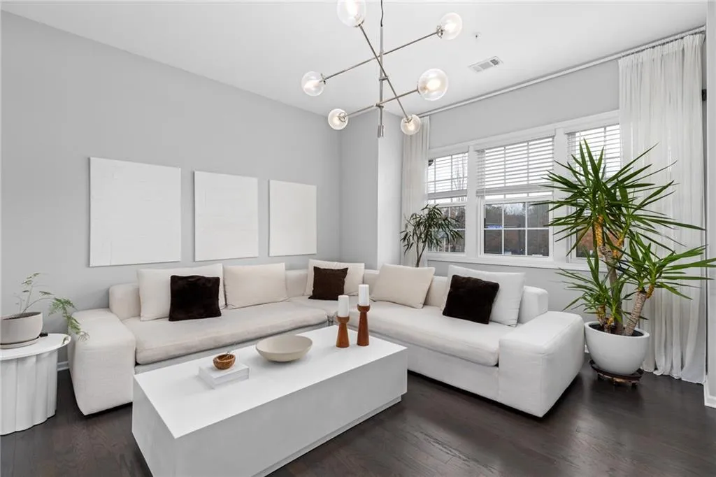 Living room featuring dark wood-style flooring