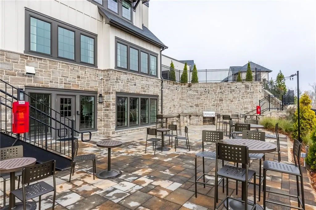 View of patio / terrace featuring outdoor dining area and stairs