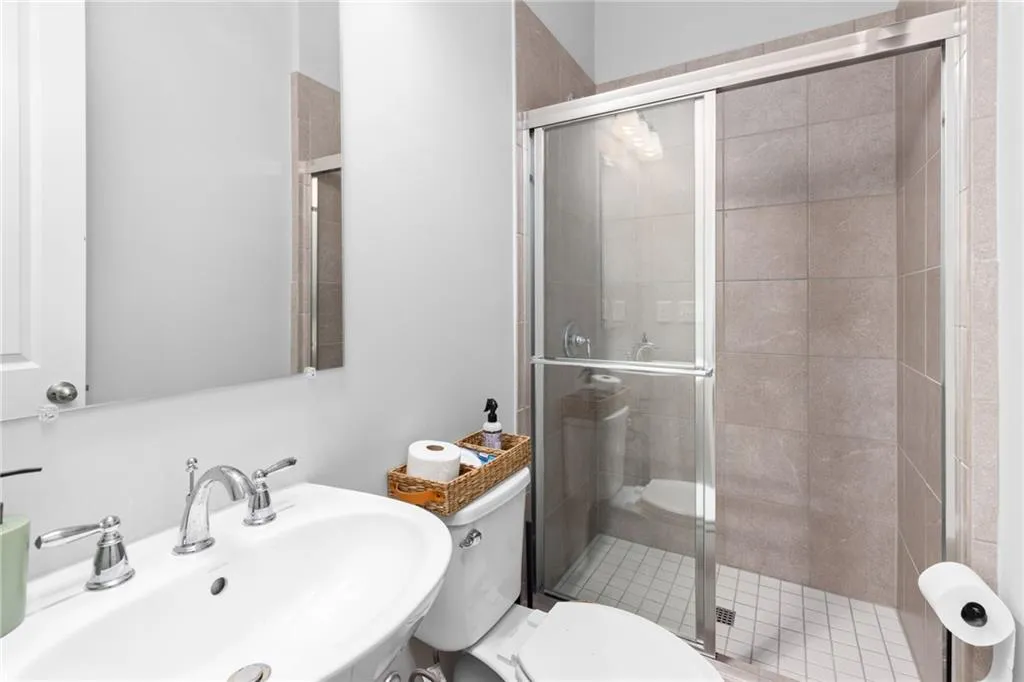 Full bath featuring a stall shower