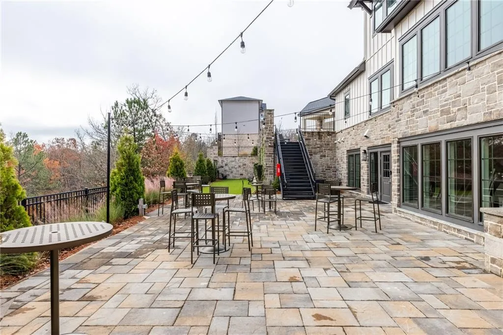 View of patio / terrace with outdoor dining area and stairs