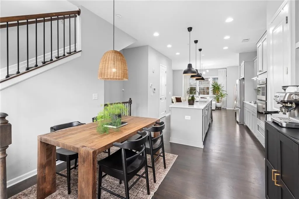 Dining room with recessed lighting and dark wood-style flooring