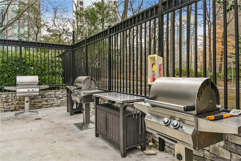 View of patio featuring grilling area and exterior kitchen