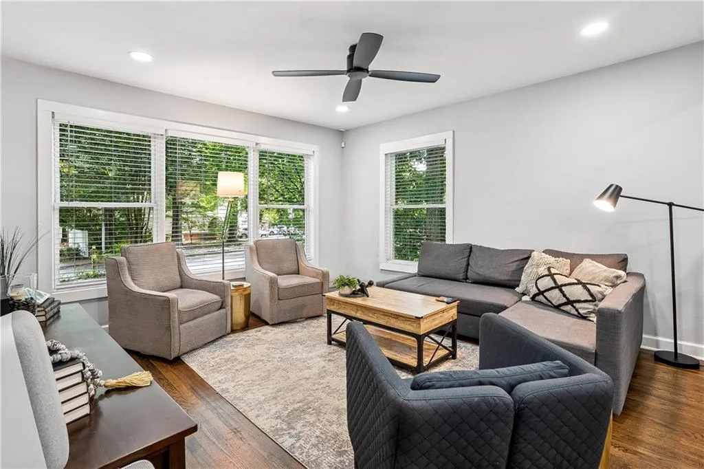 Living area featuring wood finished floors, recessed lighting, and ceiling fan