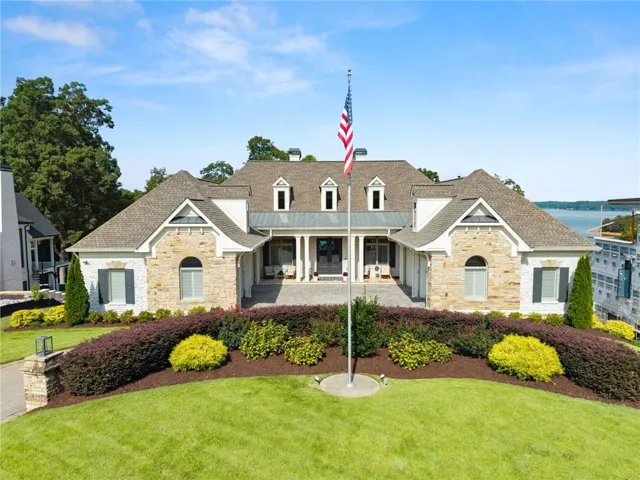 Stone and stucco exterior with multiple gables and dormer windows