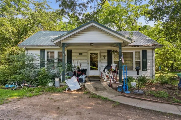 Bungalow featuring covered porch