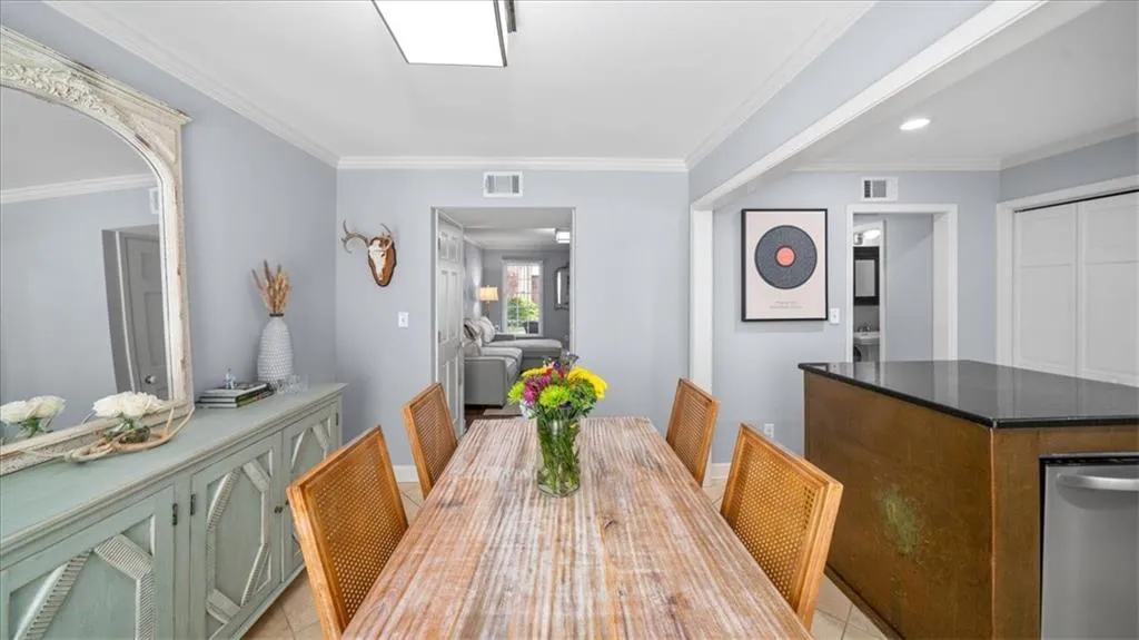 Tiled dining area with ornamental molding