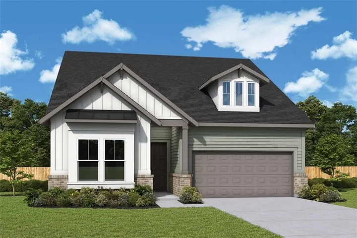 Contemporary exterior featuring mixed material siding, a prominent front-facing gable, and a dormer window