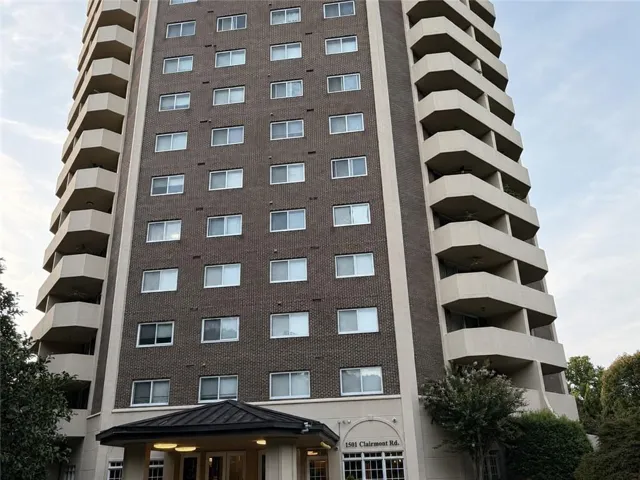 High-rise building with a brick facade and numerous windows