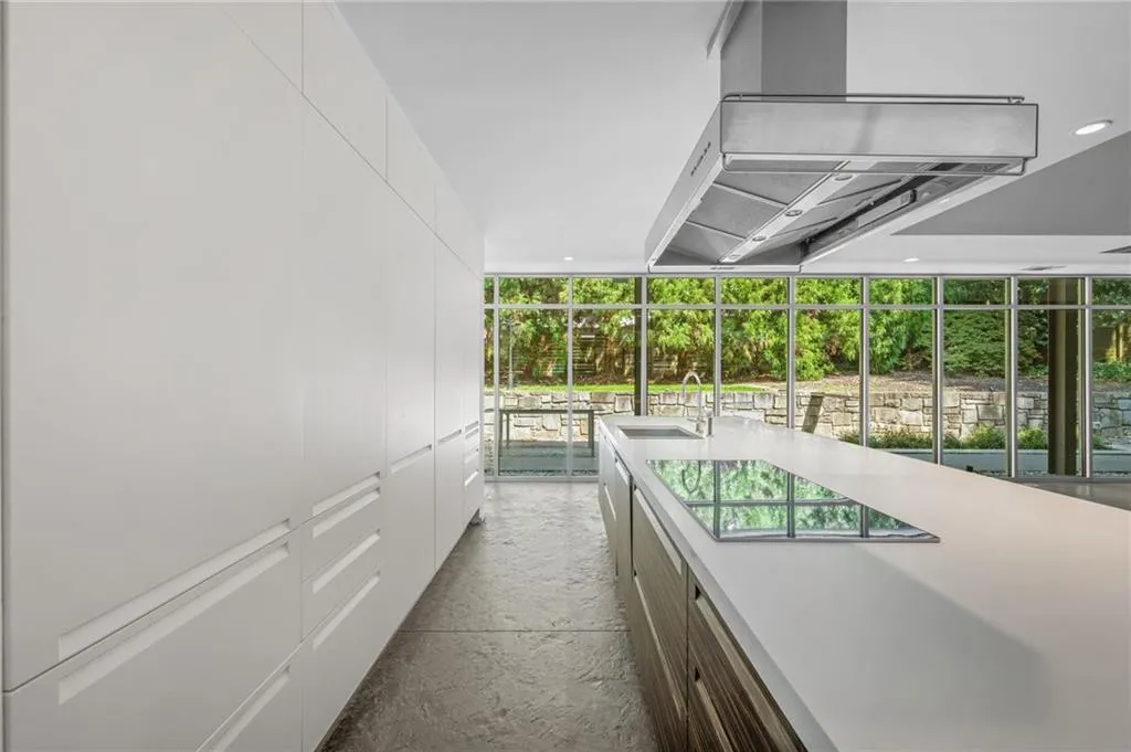 Hallway featuring a sink