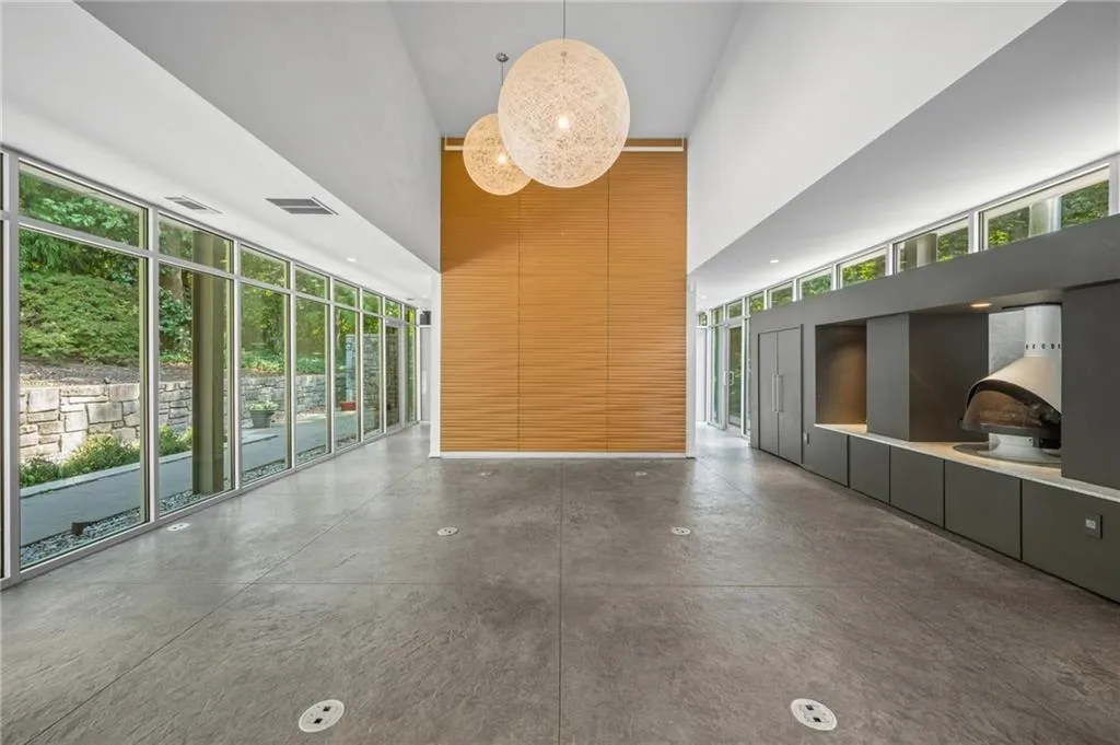 Lobby featuring a high ceiling and a wall of windows