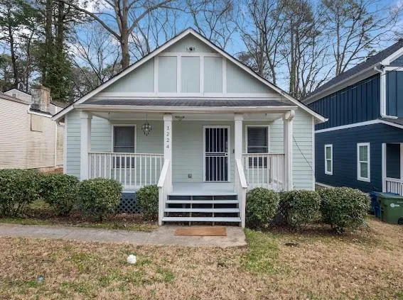 Bungalow featuring a porch