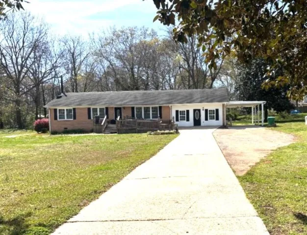 Single garage is in the back behind the fenced yard