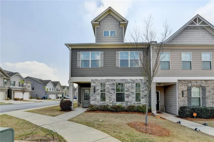 Craftsman-style house featuring a residential view of community, sidewalks and landscaped front yard.