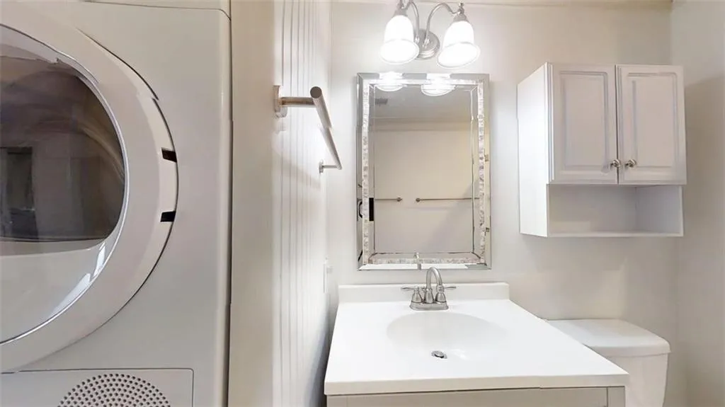 Bathroom with toilet and vanity