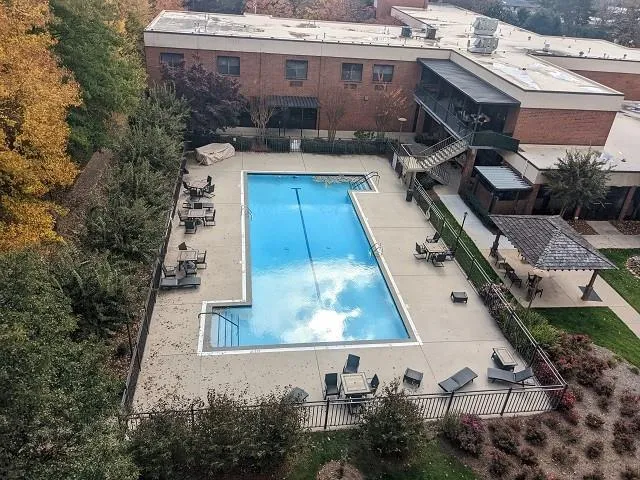 Community pool featuring a patio