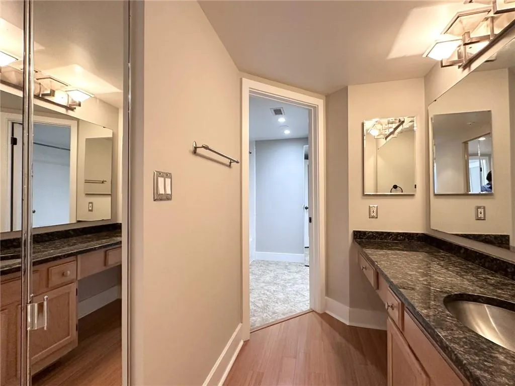 Bathroom featuring light wood-type flooring and vanity