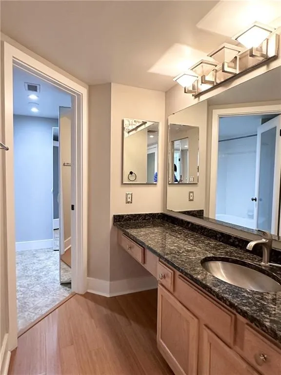 Bathroom featuring light wood-style floors and vanity