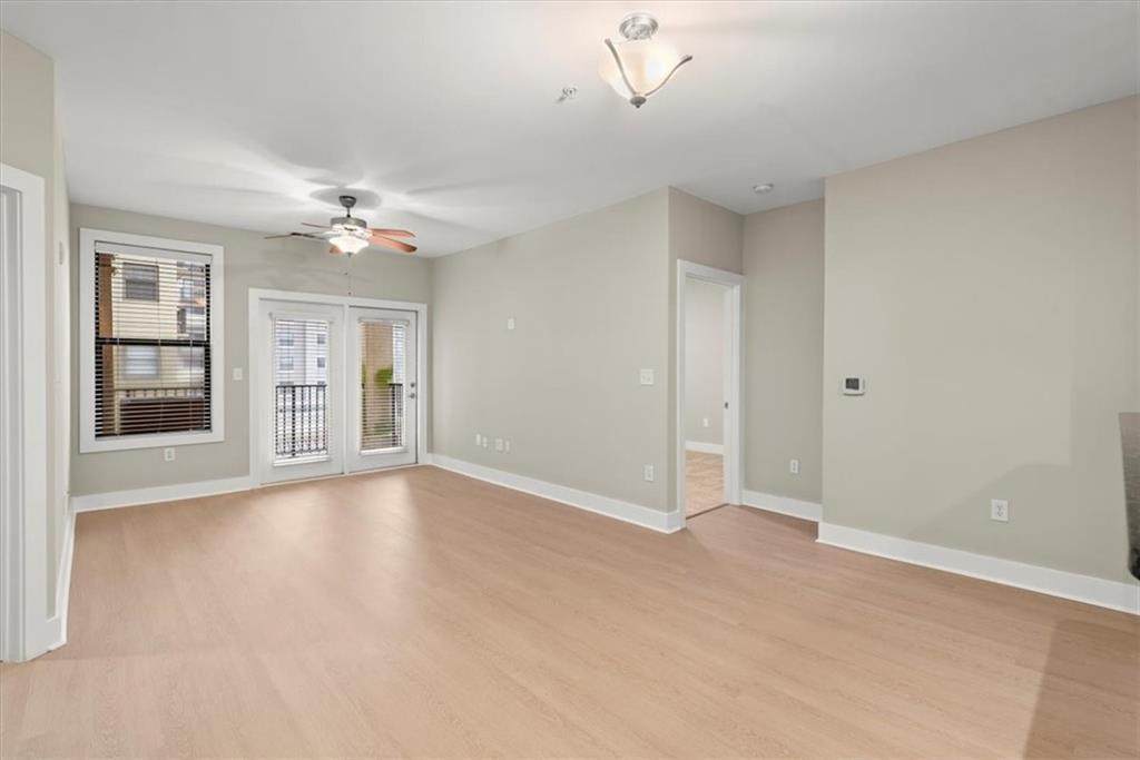 Spare room featuring light wood-type flooring and ceiling fan