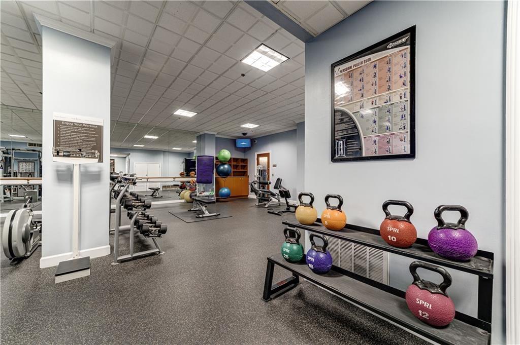 Gym with a paneled ceiling