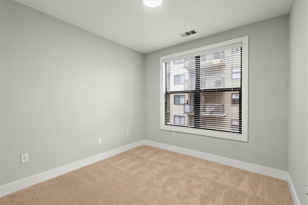 View of carpeted spare room