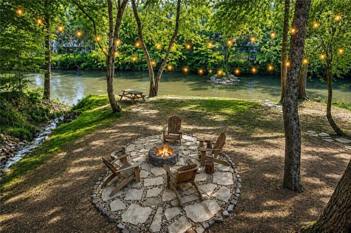 Gather Around the Fire Pit with a River View