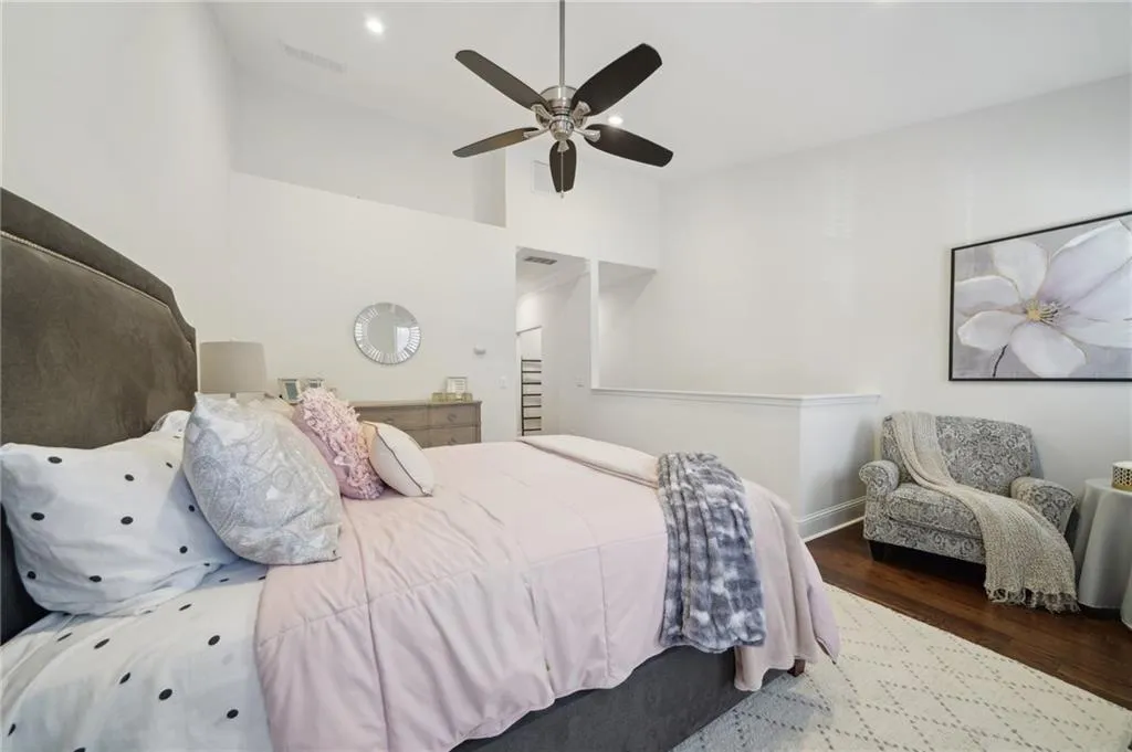 Bedroom featuring recessed lighting, baseboards, visible vents, a ceiling fan, and wood finished floors