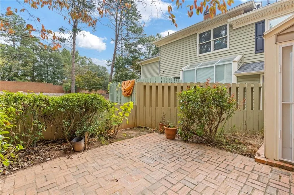 Fenced backyard with a patio