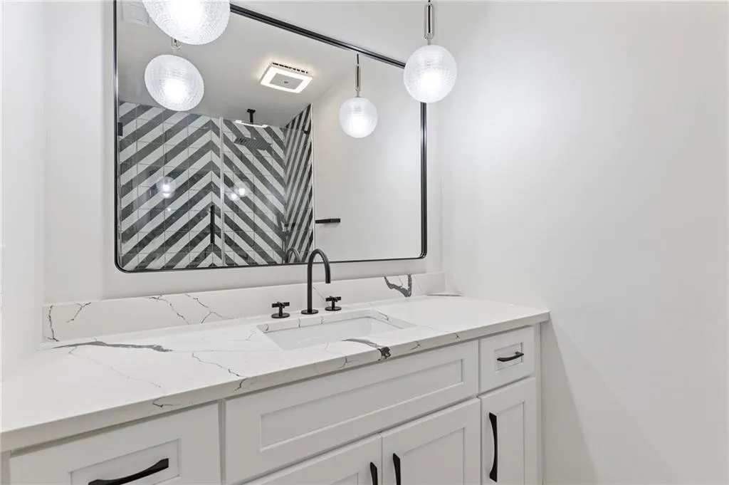 Bathroom with vanity and a shower