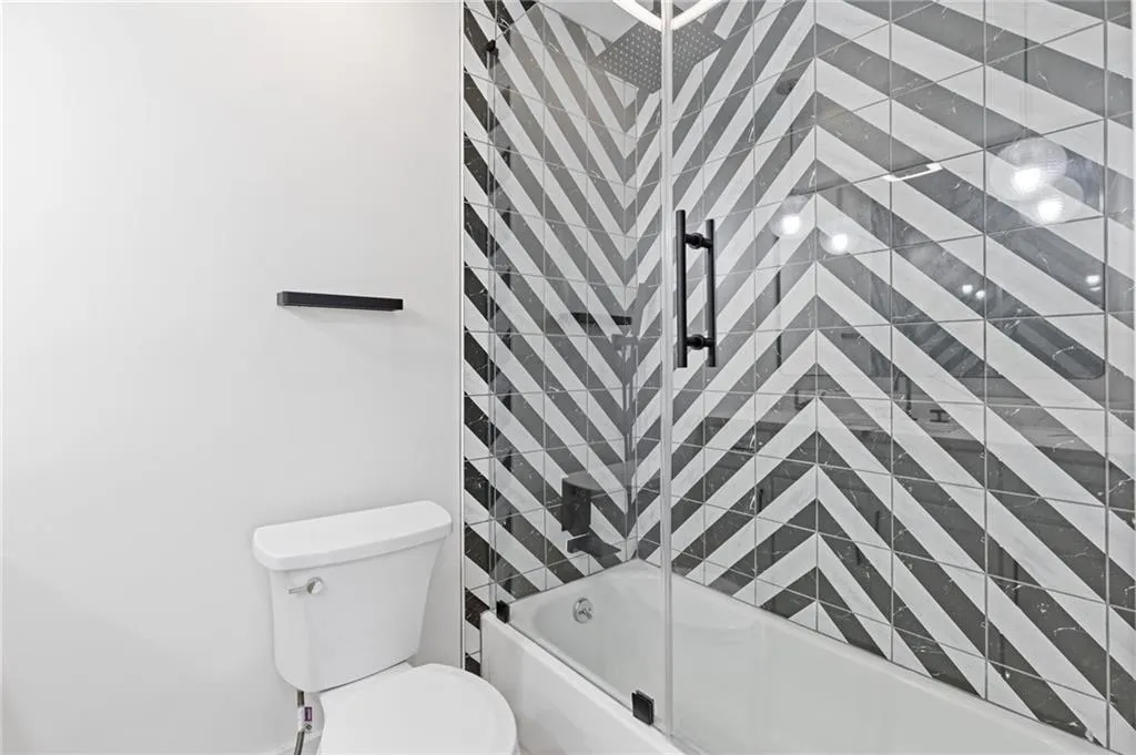 Full bathroom featuring  shower combination and toilet