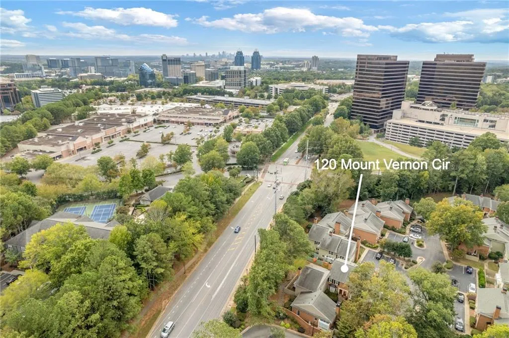 Aerial view of property's location with nearby urban area