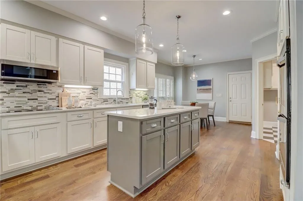 Kitchen to breakfast area, laundry room, & garage