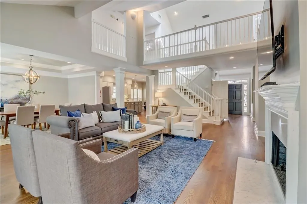 Great room view to foyer, kitchen, & catwalk