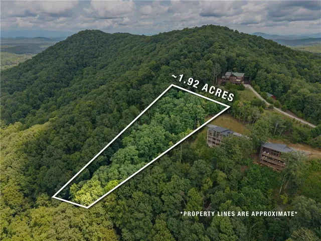 Approximately 1.92-acre wooded lot with surrounding mountainous terrain