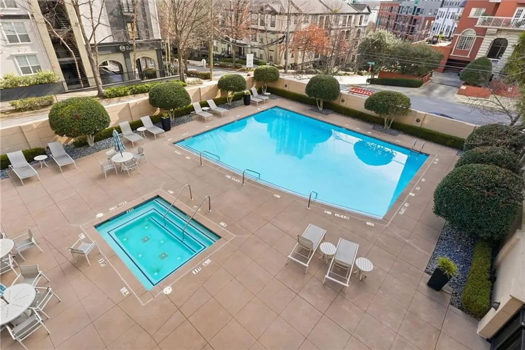 Community pool with a patio