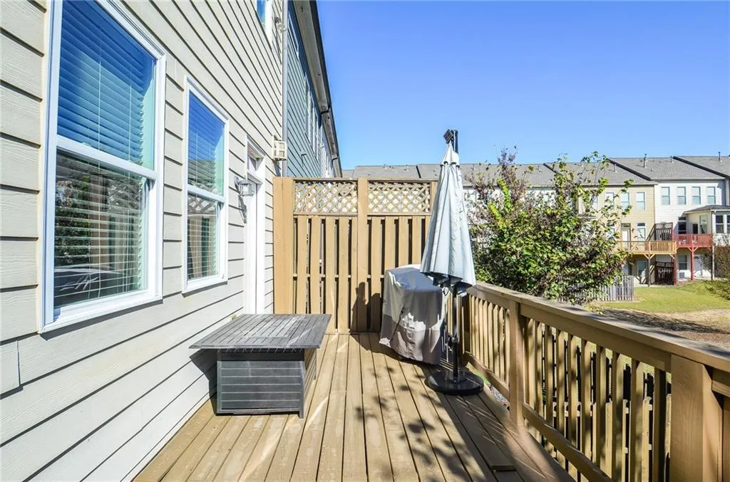 Deck featuring grilling area and a green space view