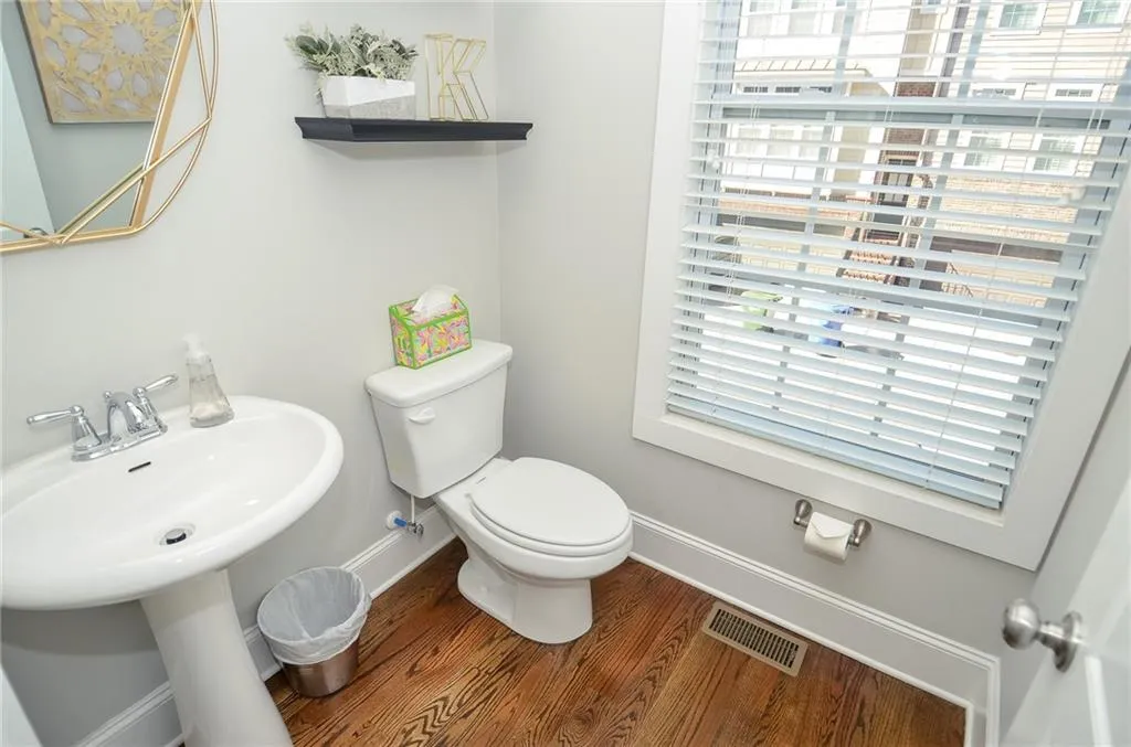 Bathroom featuring baseboards and wood finished floors