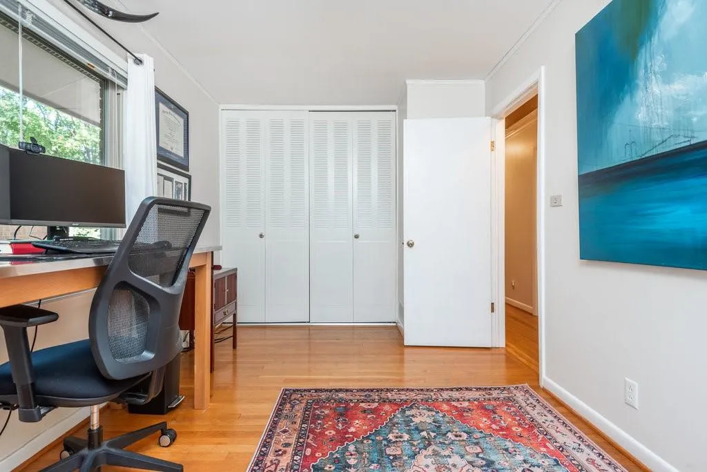 Office featuring crown molding and light hardwood / wood-style flooring