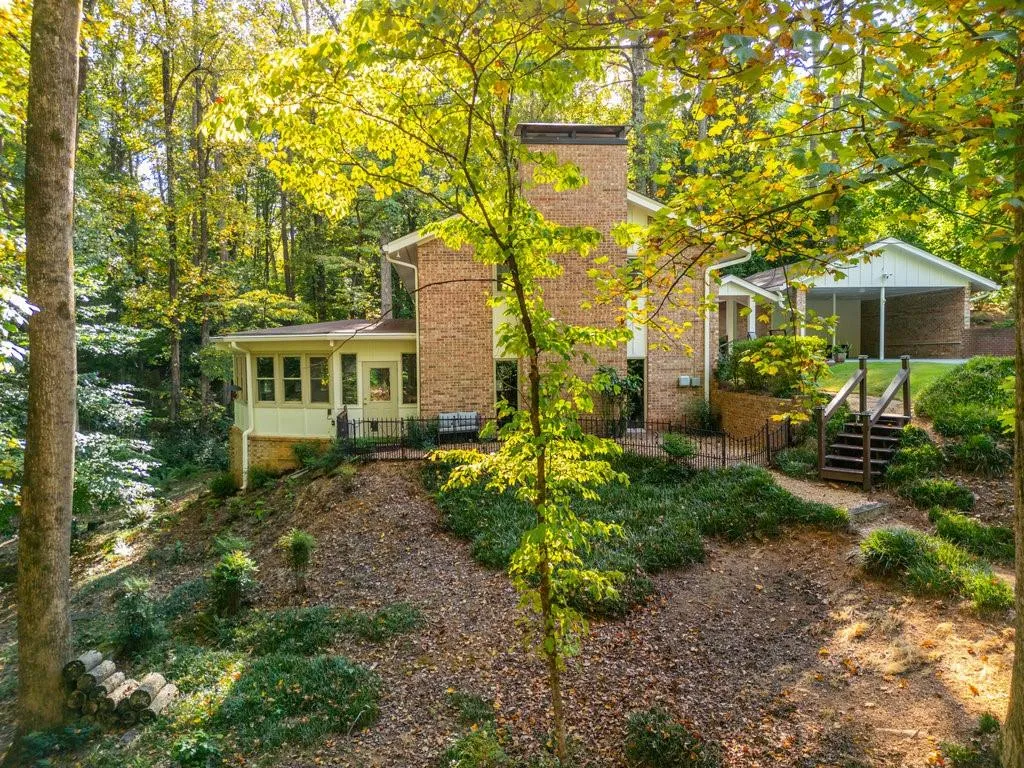 Rear view of house featuring a deck