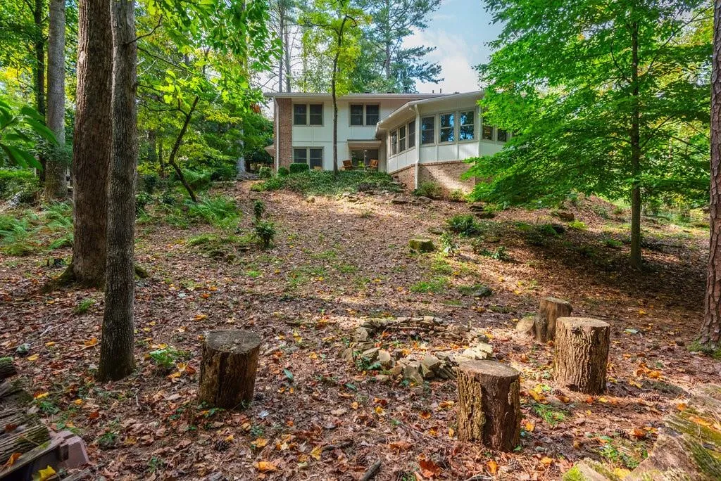 Rear view of property featuring a sunroom