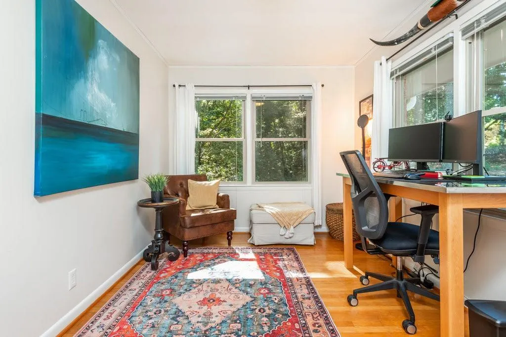 Home office featuring crown molding and hardwood / wood-style floors