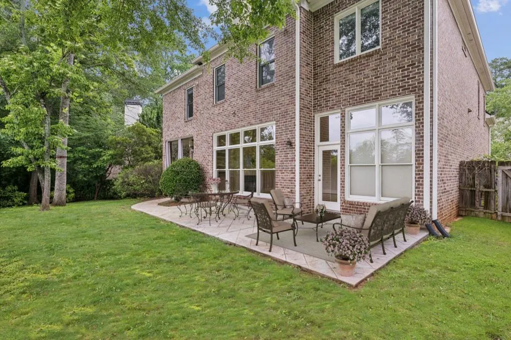 Rear Patio Overlooking A Flat, Fully Fenced Backyard