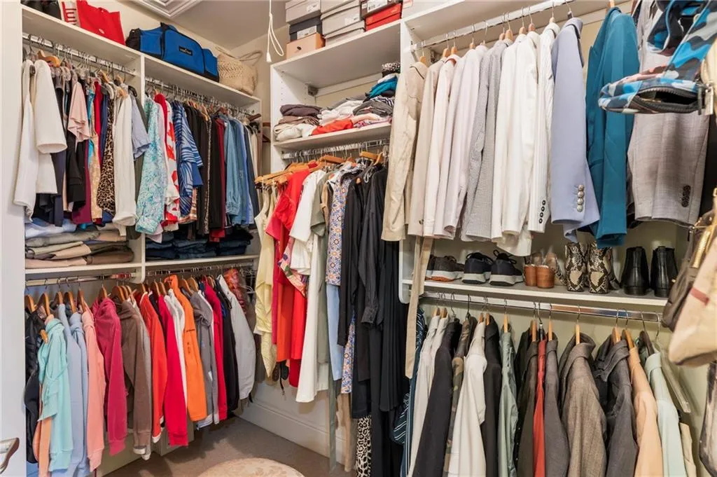 Walk in closet with baseboard heating