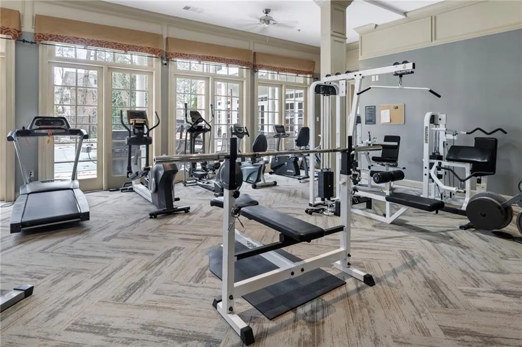 Workout area featuring ceiling fan