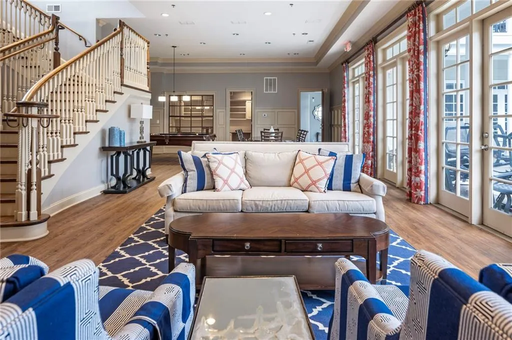 Living room with wood finished floors and recessed lighting