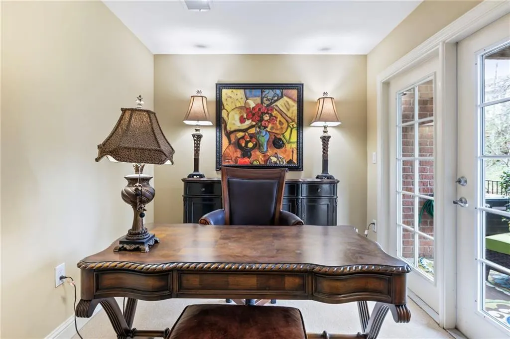 Home office with carpet and french doors
