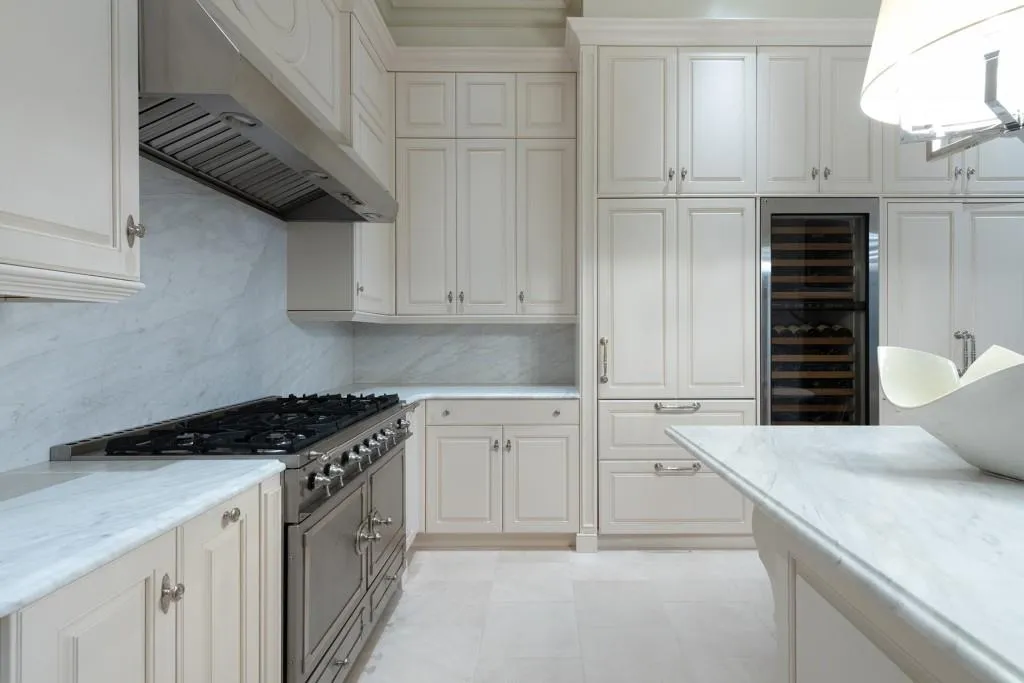 La Cornue stove, marble counter tops and custom cabinetry