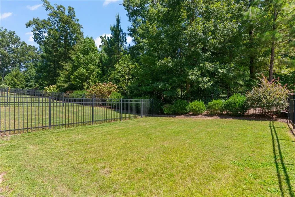 Fenced area directly off back patio