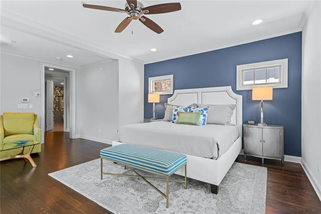 Primary _ Symmetrical architectural windows and accent wall add depth & drama creating a serene sleep sanctuary
