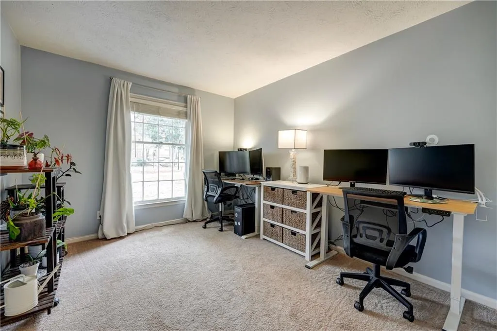 Third bedroom or office with light carpet